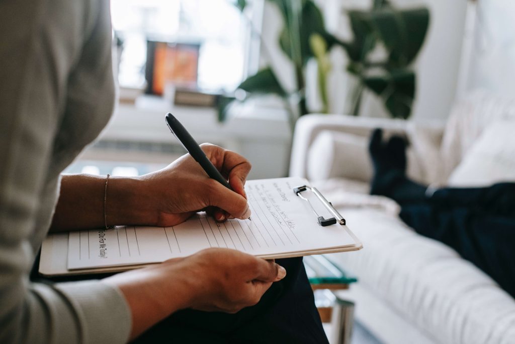 A patient filling out the needed forms needed for their appointment